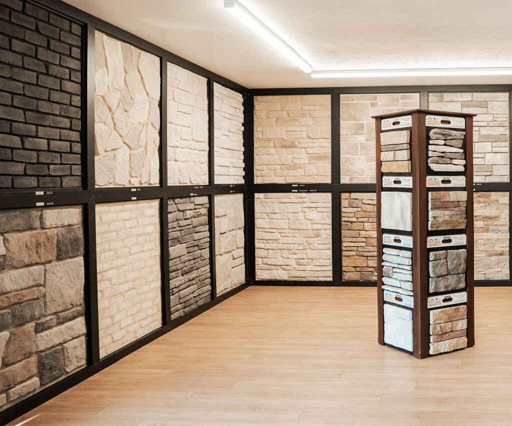 Stone veneer showroom display featuring multiple color and texture options.